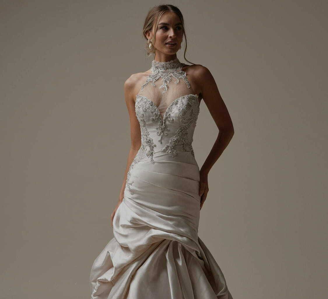 Photo of the posing model wearing a white bridal gown - Mobile Image